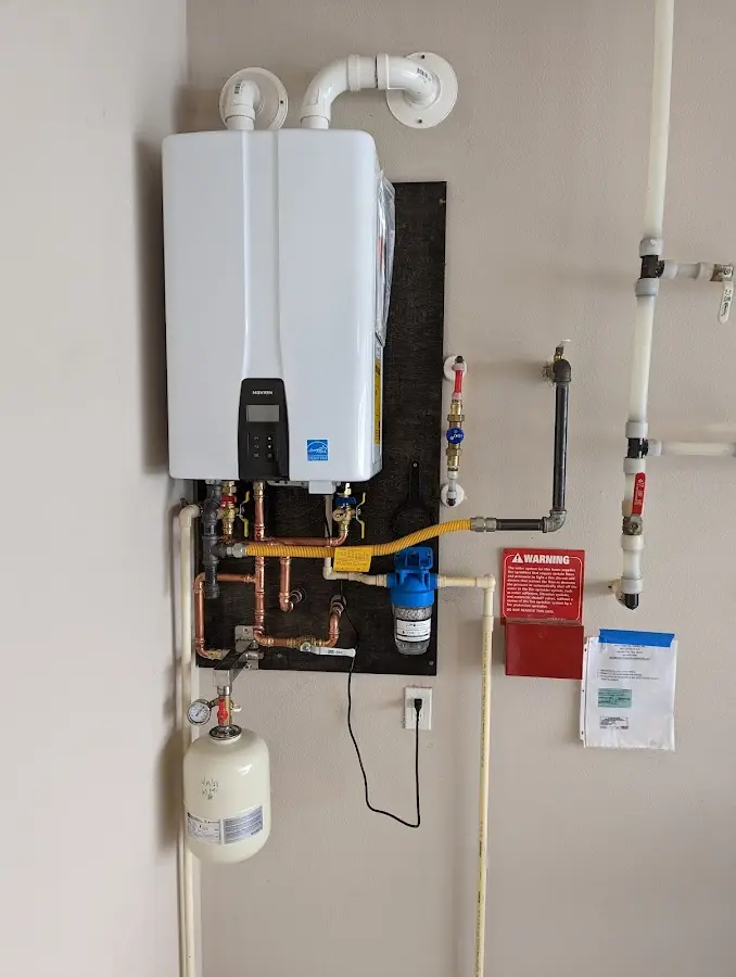 Professional plumber installing copper piping in a Bridgeview home